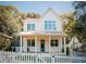 Two-story white farmhouse with a front porch and picket fence at 185 Marion # B, Atlanta, GA 30307