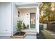 Inviting front porch with green door and wooden chair at 185 Marion # B, Atlanta, GA 30307