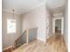 Light-filled upper hallway with hardwood floors and modern staircase at 185 Marion # B, Atlanta, GA 30307