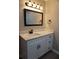 Bathroom featuring a white vanity with drawers, a large mirror and modern fixtures at 2002 Country Park Se Dr, Smyrna, GA 30080