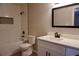 Well-lit bathroom with shower-tub combination, modern vanity and fixtures at 2002 Country Park Se Dr, Smyrna, GA 30080