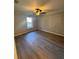 Bright bedroom with hardwood floors and ceiling fan at 2002 Country Park Se Dr, Smyrna, GA 30080