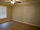 Bright bedroom with a ceiling fan, hardwood floors and large window at 2002 Country Park Se Dr, Smyrna, GA 30080