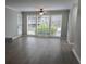 Bright and airy living room enhanced by large windows, providing natural light and pleasant views of the surroundings at 2002 Country Park Se Dr, Smyrna, GA 30080