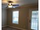 A bright and spacious living room with a ceiling fan and patio access at 2002 Country Park Se Dr, Smyrna, GA 30080