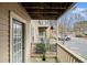 Cozy balcony space with wood railing and adjacent parking at 2002 Country Se Dr, Smyrna, GA 30080