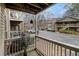 Cozy balcony space with wood railing and adjacent parking at 2002 Country Se Dr, Smyrna, GA 30080