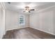 Bedroom with ceiling fan, wood-look flooring, neutral paint and lots of light at 2002 Country Se Dr, Smyrna, GA 30080