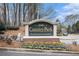 Country Park Condominiums community sign surrounded by well-maintained landscaping and mature trees at 2002 Country Se Dr, Smyrna, GA 30080