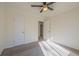 Spacious bedroom with ceiling fan and carpet at 3276 Rollingbrook Way, Duluth, GA 30096