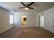 Spacious bedroom with ceiling fan and carpet flooring at 3276 Rollingbrook Way, Duluth, GA 30096