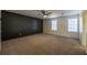 Spacious bedroom with neutral carpeting and ceiling fan at 3276 Rollingbrook Way, Duluth, GA 30096