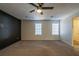 Large bedroom with neutral carpeting and two windows at 3276 Rollingbrook Way, Duluth, GA 30096