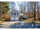 Two-story house with gray siding, two-car garage, and a yard at 3276 Rollingbrook Way, Duluth, GA 30096