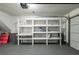 Garage with built-in shelving units for storage at 3276 Rollingbrook Way, Duluth, GA 30096