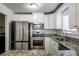 Kitchen with stainless steel appliances and granite countertops at 3276 Rollingbrook Way, Duluth, GA 30096