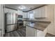 Spacious kitchen with stainless steel appliances and granite island at 3276 Rollingbrook Way, Duluth, GA 30096