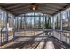 Screened porch with brick floor and ceiling fan at 3276 Rollingbrook Way, Duluth, GA 30096