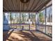 Screened porch with brick flooring and backyard view at 3276 Rollingbrook Way, Duluth, GA 30096