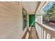 Private balcony with wood flooring and green door at 3488 Shepherds Path, Decatur, GA 30034