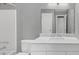 Updated bathroom with white vanity, marble top, and bathtub at 3488 Shepherds Path, Decatur, GA 30034