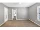 Bright bedroom with carpet, neutral walls and door to bathroom at 3488 Shepherds Path, Decatur, GA 30034