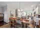 Open concept dining room with a view into the kitchen and living areas at 1184 Warner Park Ct, Decatur, GA 30033