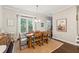 Bright dining room with hardwood floors and a rustic wooden table at 1184 Warner Park Ct, Decatur, GA 30033