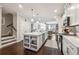 Open concept kitchen with white cabinets, large island, and stainless steel appliances at 1184 Warner Park Ct, Decatur, GA 30033