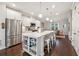 Modern kitchen with white cabinets, stainless steel appliances, and an island with seating at 1184 Warner Park Ct, Decatur, GA 30033