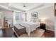 Main bedroom with king-size bed, walk-in closet, and hardwood floors at 1184 Warner Park Ct, Decatur, GA 30033