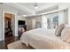 Main bedroom with king bed, walk-in closet, and ceiling fan at 1184 Warner Park Ct, Decatur, GA 30033