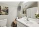 Clean bathroom with a single vanity, toilet, and shower/tub combo at 1263 Irwin Lake Way, Marietta, GA 30064