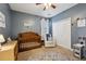 Charming Bedroom with a crib, armchair, and built-in closet at 1263 Irwin Lake Way, Marietta, GA 30064