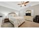 Bright bedroom with a queen bed, dresser, and wall-mounted TV at 1263 Irwin Lake Way, Marietta, GA 30064