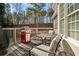 Deck with gas grill, table and chairs, and wooded backdrop at 1263 Irwin Lake Way, Marietta, GA 30064