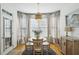 Bright dining room with white table and chairs at 1263 Irwin Lake Way, Marietta, GA 30064