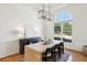 Elegant dining room featuring a large window and modern chandelier at 1263 Irwin Lake Way, Marietta, GA 30064