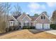 Two-story brick home with a three-car garage at 1263 Irwin Lake Way, Marietta, GA 30064