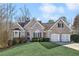 Brick house with two-car garage and landscaped lawn at 1263 Irwin Lake Way, Marietta, GA 30064