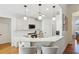 Modern kitchen with white cabinets and quartz countertops at 1263 Irwin Lake Way, Marietta, GA 30064