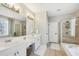 Double vanity bathroom with soaking tub and walk-in shower at 1263 Irwin Lake Way, Marietta, GA 30064