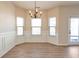 Bright dining room features hardwood floors, wainscoting, and a chandelier at 2375 Morgan Farm Dr, Buford, GA 30519