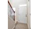 Entryway with white door and hardwood floors at 2375 Morgan Farm Dr, Buford, GA 30519