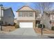 Two-story house with a white garage door and landscaping at 2375 Morgan Farm Dr, Buford, GA 30519