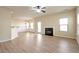 Open living room with hardwood floors and a fireplace at 2375 Morgan Farm Dr, Buford, GA 30519