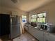 Kitchen with white cabinets, stainless steel appliances, and tile floor at 2642 Joyce Ave, Decatur, GA 30032