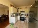 Kitchen with white cabinets, stainless steel appliances, and tile floor at 2642 Joyce Ave, Decatur, GA 30032