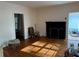 Living room with hardwood floors, fireplace, and access to sunroom at 2642 Joyce Ave, Decatur, GA 30032