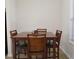 Simple dining area with a square table and four chairs at 2920 Fleetwood Dr, Cumming, GA 30041